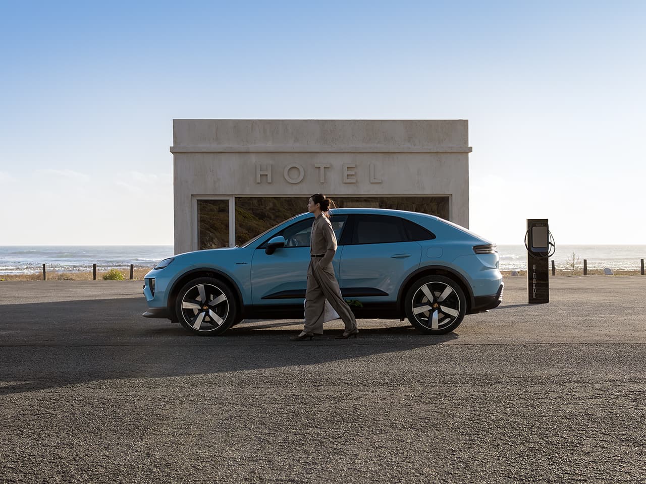 Porsche Macan in front of a building